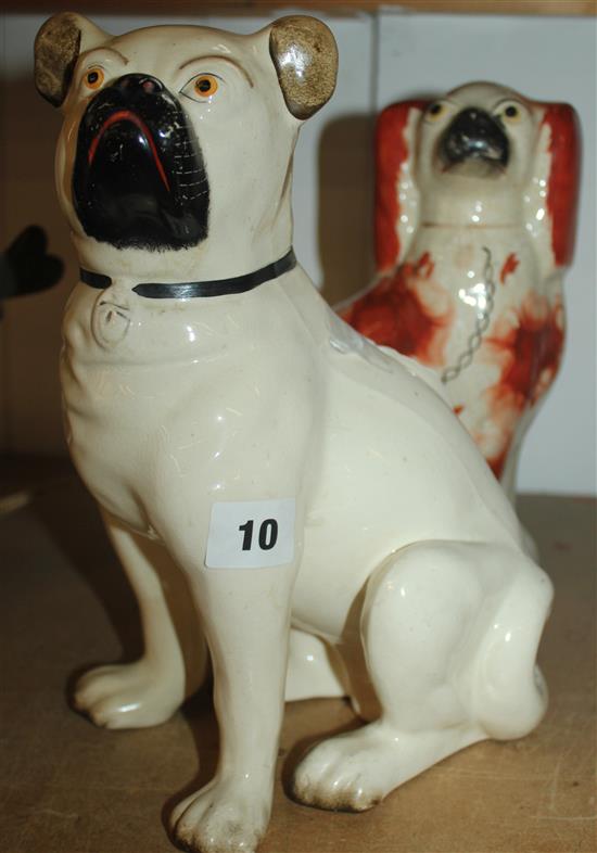 19C pottery figure of a seated pug & a Staffordshire fireside spaniel